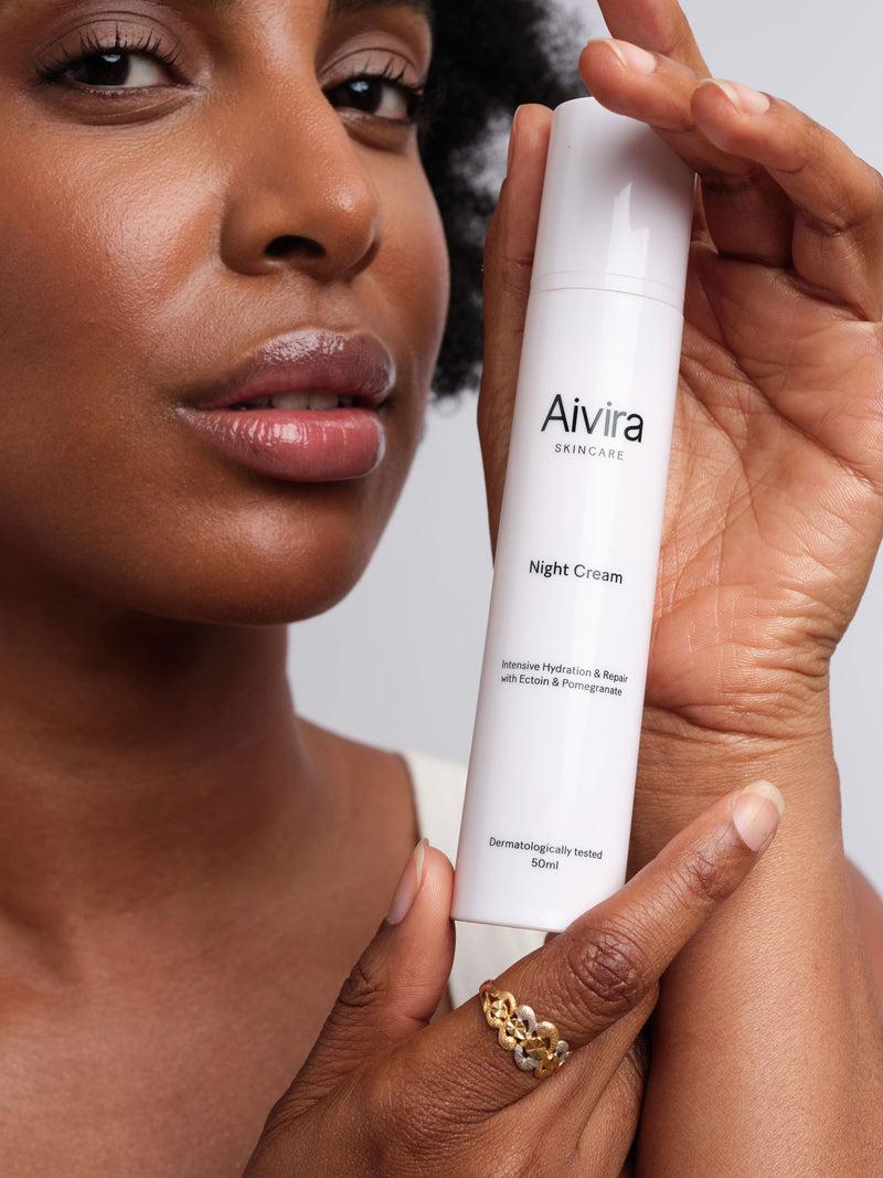 model with Aivira Night Cream in hands